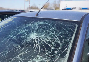 Cracked windshield of a customers car is at lg auto glass store